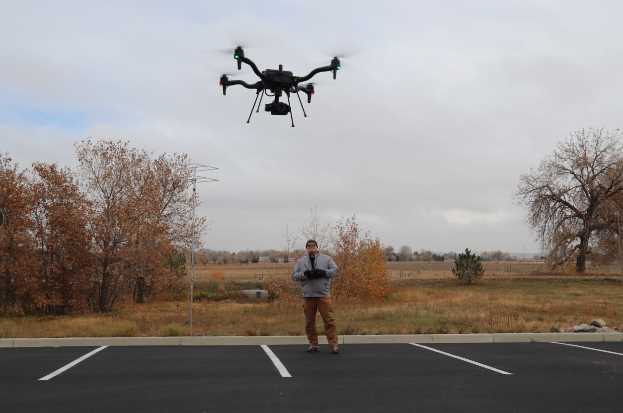 Jason Duckworth operating drone for field operations and data collection